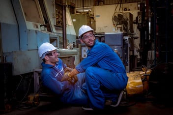 Accident investigation: worker helping out a hurt colleague