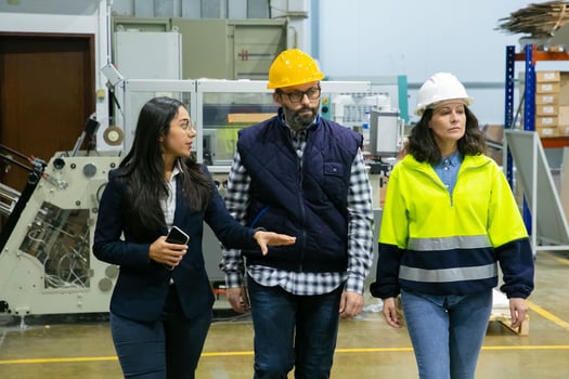 Inspector and engineers conducting safety audits