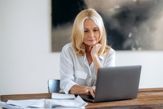 HR compliance software: entrepreneur using a laptop