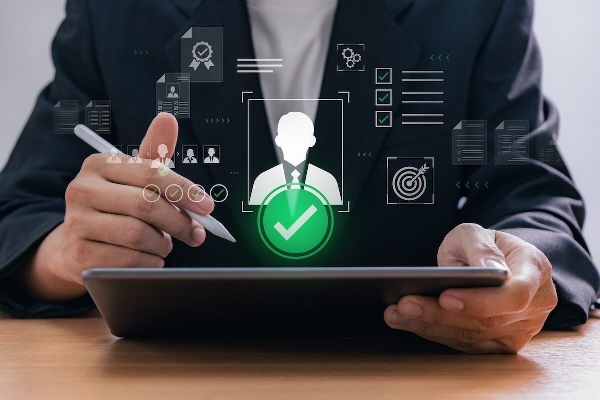 Entrepreneur using a tablet with holographic dashboard showing user profile icons and a checklist