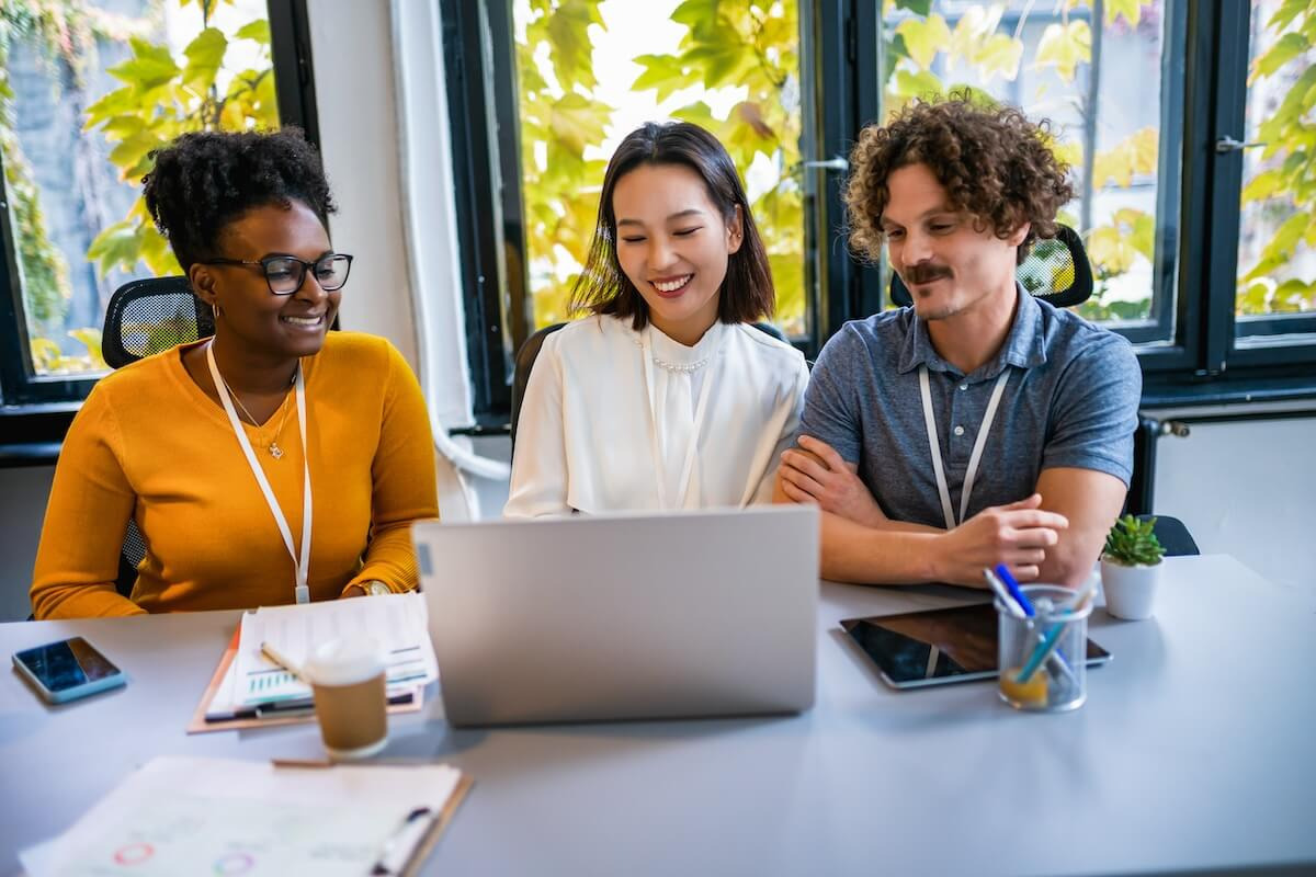 Team looking at a laptop