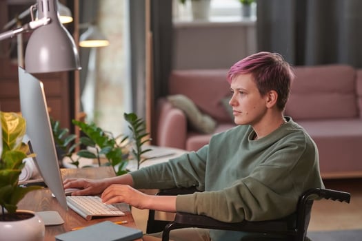 ADA reasonable accommodation checklist: employee in a wheelchair using a computer