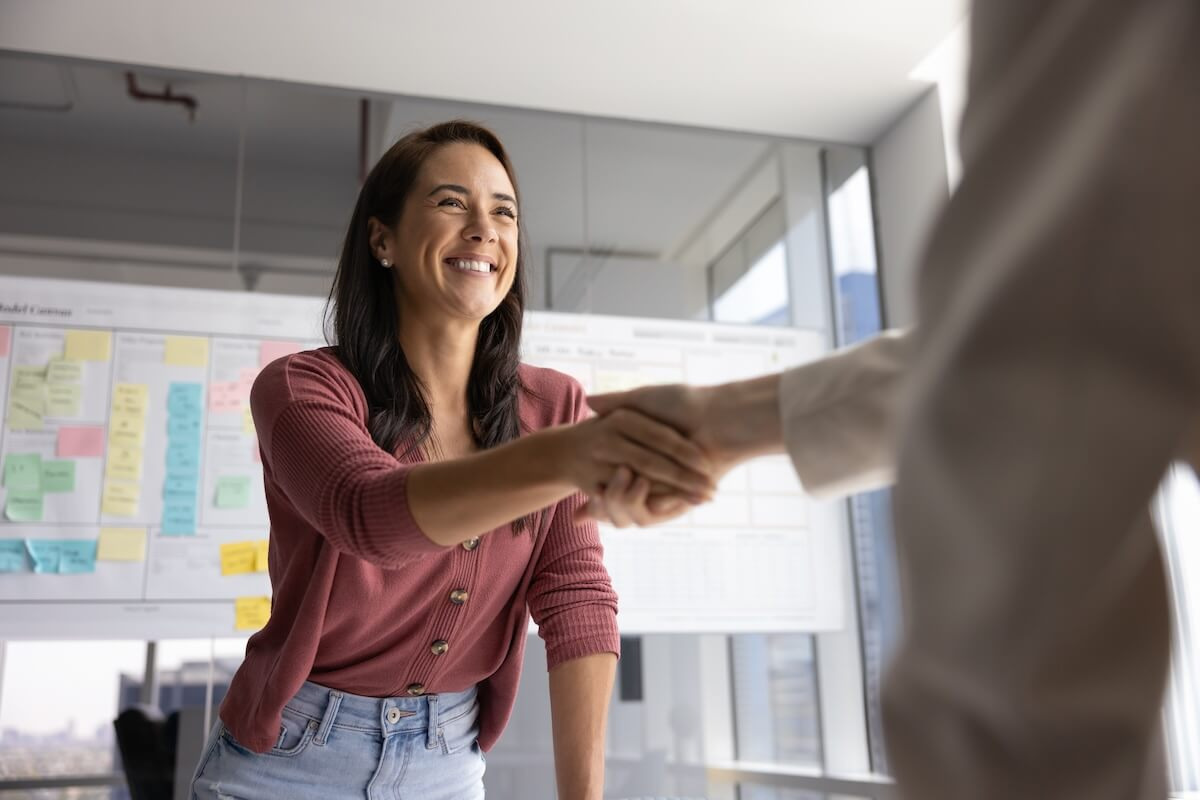 HR staff shaking hands with an employee