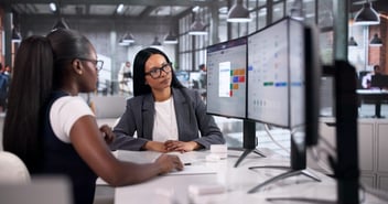 Online leave management system: colleagues looking at a monitor