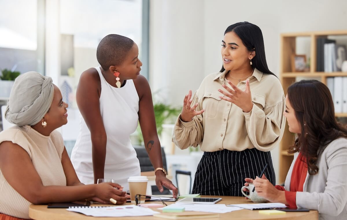 How to improve employee communication in the workplace: team brainstorming at their office