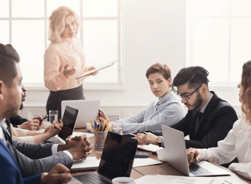 Employee disciplinary process: manager talking to an employee during a meeting