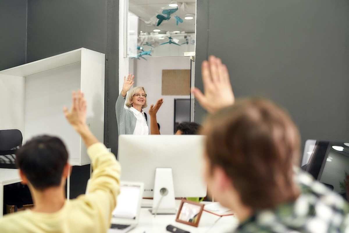Manager waving to her employees