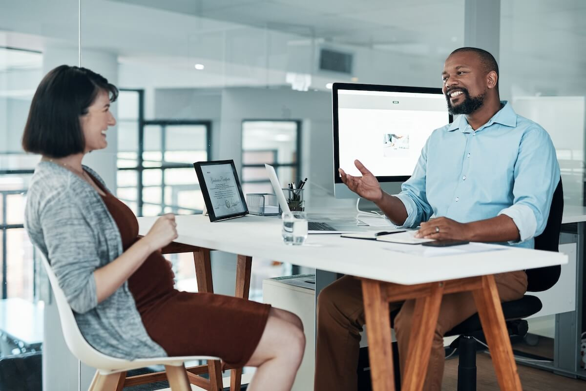Progressive discipline process: pregnant employee talking to an HR employee