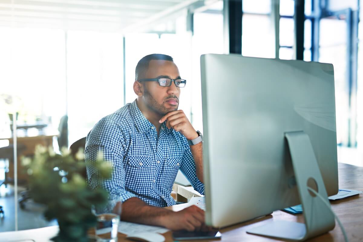 Scalable leave management: HR employee using a computer