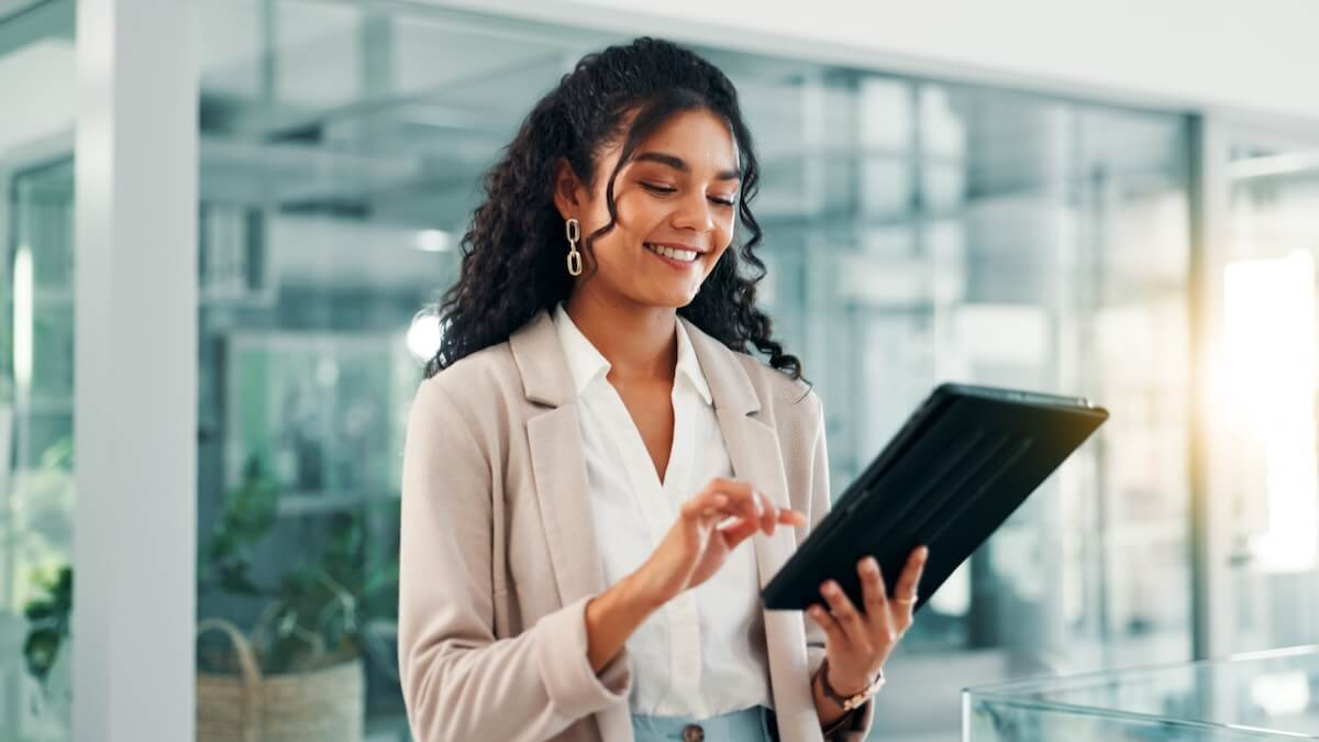 Employee happily using a tablet
