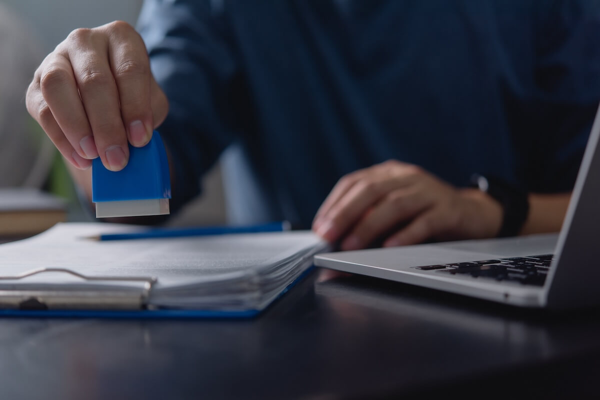 Employee stamping a document