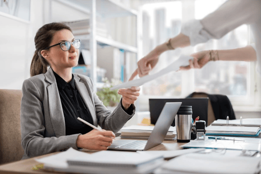 Policy violation documentation: HR manager receiving a document from an employee