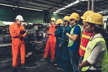 Foreman discussing their safety training to the rest of the team