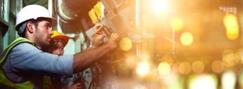 Process safety management: 2 mechanics repairing a machine